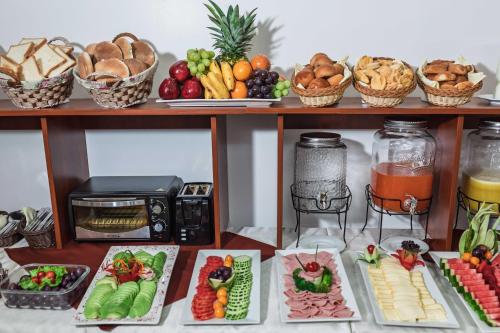 a table filled with different types of fruits and vegetables at Quechua Hotel Cusco in Cusco