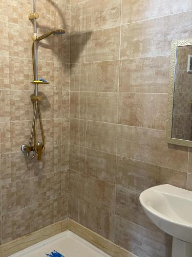 a bathroom with a shower and a sink at Appartement de luxe à Tanger Maroc in Tangier