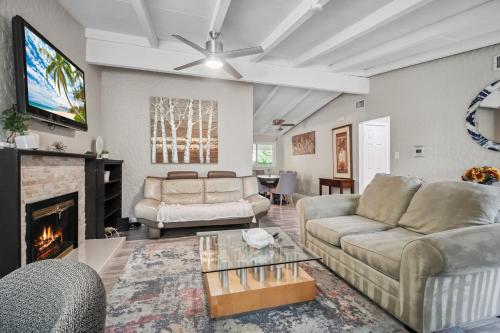 a living room with two couches and a fireplace at The Perfect Vacation Spot Near Six Flags Magic Mountain in Santa Clarita