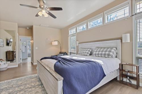 a bedroom with a large bed with a ceiling fan at Eagles Landing Spacious Family Getaway w Office in Eagle