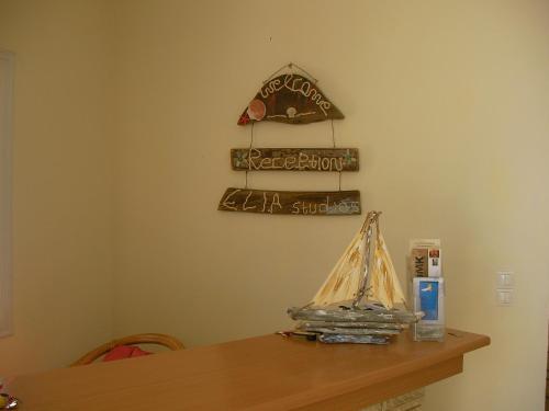 a wooden table with a model boat on it at Elia Studios in Palekastron