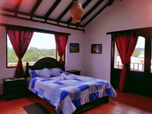 Postel nebo postele na pokoji v ubytování Finca Villa Claudia