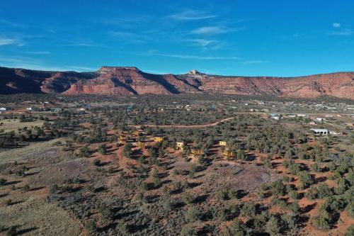 an aerial view of a desert with mountains and trees at Tiny Cabin #3 at The Cedars in Kanab