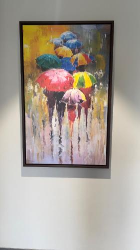 a painting of a crowd of people with umbrellas at Ved Villa Netflix, Pool, Chill in Panchgani