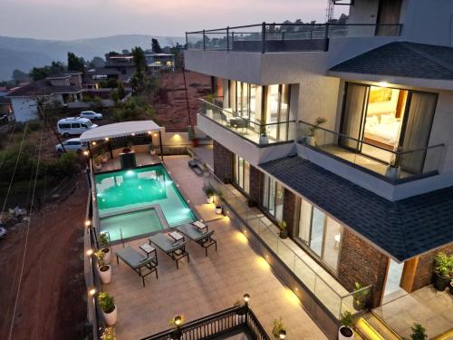 an aerial view of a house with a swimming pool at Ved Villa Netflix, Pool, Chill in Panchgani