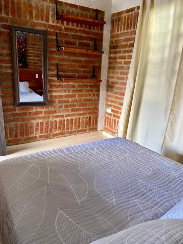 Cama o camas de una habitación en Cabaña el Anhelo