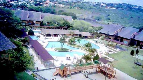 an aerial view of a swimming pool at a resort at Flat Completo 2 Quartos Winterville - Gravatá in Gravatá