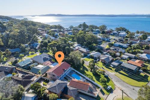 an aerial view of houses in a suburb with a marker at Pet friendly 24 Irawari Crescent - pool, air con, boat parking in Nelson Bay