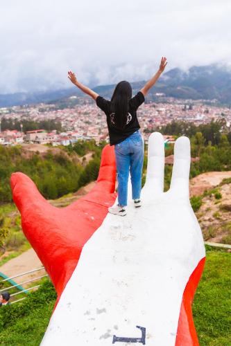 a woman standing on the top of a mountain at Terra Imperial in Chachapoyas