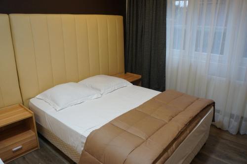 Postel nebo postele na pokoji v ubytování Hotel Evergreen