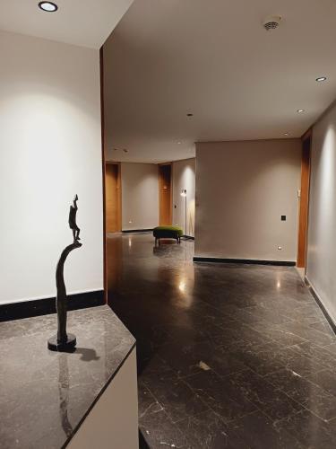 a large empty room with a sculpture on a counter at Panoramic ocean view appartement in Casablanca