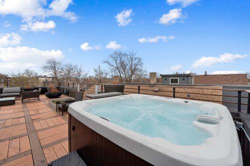 a hot tub on the roof of a building at 5BR 5BA Architectural Estate-Theatre Gym Rooftop in Chicago