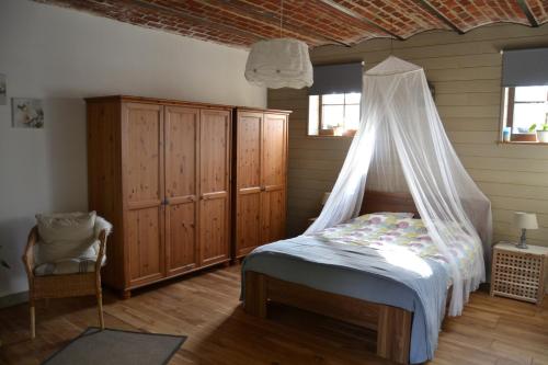 A bed or beds in a room at Gîte de l'Espinette
