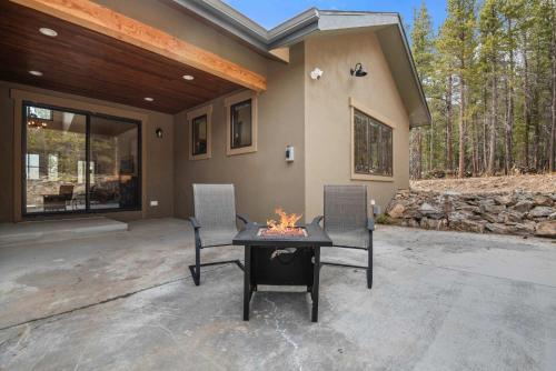 a patio with a table and chairs in front of a house at 34 Acre Escape Games Hiking Pool Table Bicycles in Black Hawk