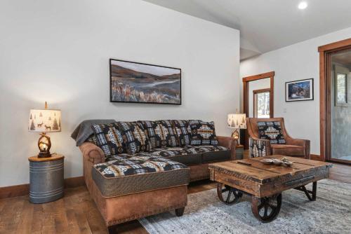 a living room with a couch and a coffee table at 34 Acre Escape Games Hiking Pool Table Bicycles in Black Hawk