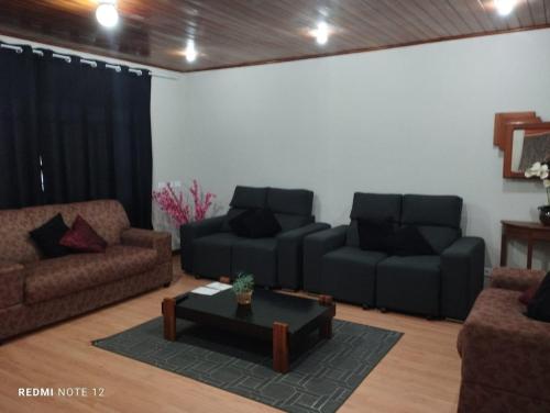 Coin salon dans l'établissement Recanto Benedetti, casa para temporada