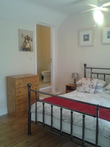 a bedroom with a bed and a bathroom at Sea Lodge B&B in Durrus
