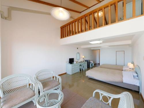 Postel nebo postele na pokoji v ubytování Resort Hotel Umibe no Kajuen