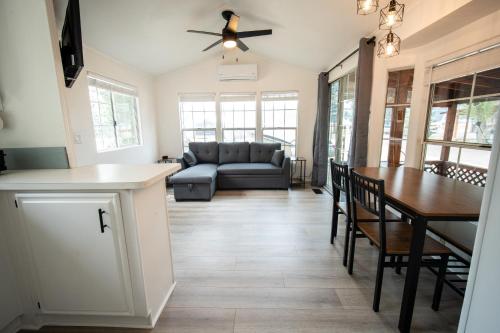 a living room with a table and a couch at Alpine Lodge Hotel in Cascade