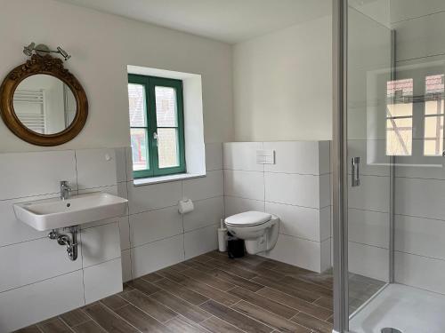 a bathroom with a toilet and a sink and a shower at Ferienhaus nahe Schweriner Seenplatte in Wendorf