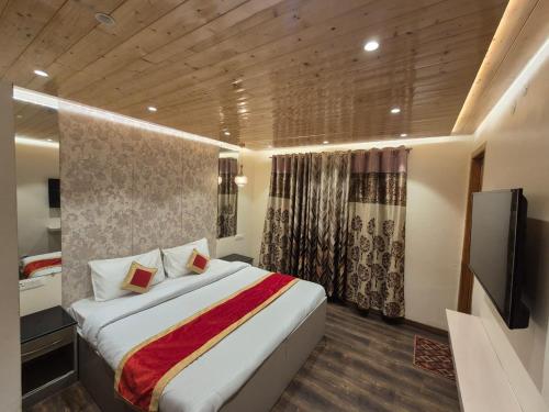 Postel nebo postele na pokoji v ubytování New Maya Home Stay