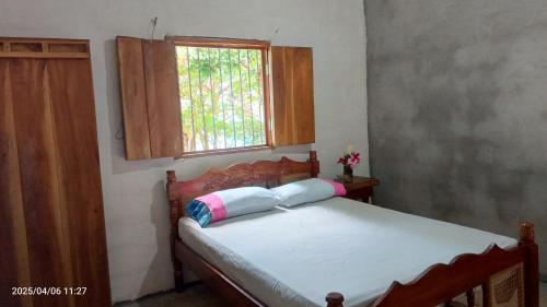 Postel nebo postele na pokoji v ubytování Habitaciones Colibrí