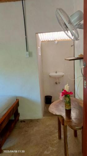 a room with a table and a sink in a room at Cabaña Colibrí Balgue in Altagracia