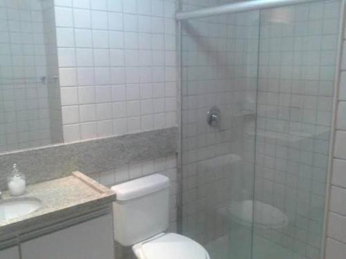 a bathroom with a shower and a toilet and a sink at Malawi Resort Experience INN in Porto De Galinhas
