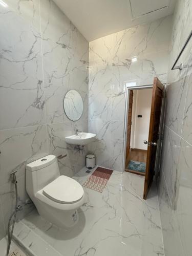 a white bathroom with a toilet and a sink at Bophut Fisherman's Village Pink Sky Villa in Koh Samui 