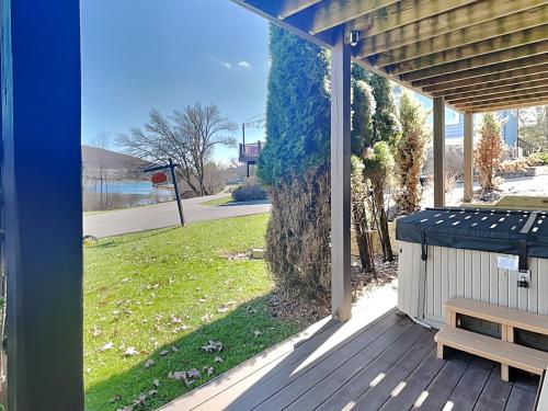 a porch with a picnic table and a bench at At the Start of It All in McHenry