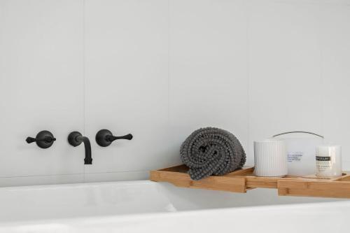 a kitchen counter with a shelf and a sink at Gully & Tide in Aireys Inlet