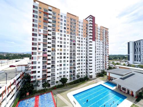 an overhead view of a large apartment building with a swimming pool at StayD'Cassia in Semenyih