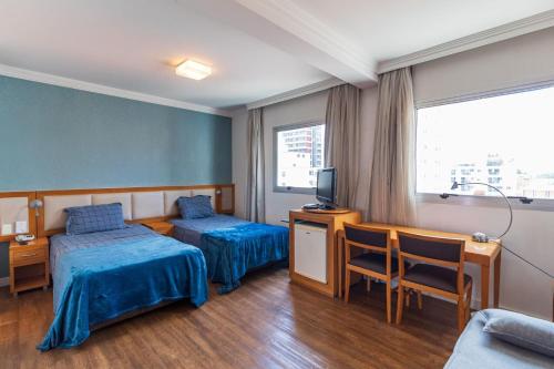 Ένα ή περισσότερα κρεβάτια σε δωμάτιο στο LFlats Hotel Oscar Freire
