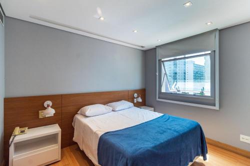 Ένα ή περισσότερα κρεβάτια σε δωμάτιο στο LFlats Hotel Oscar Freire