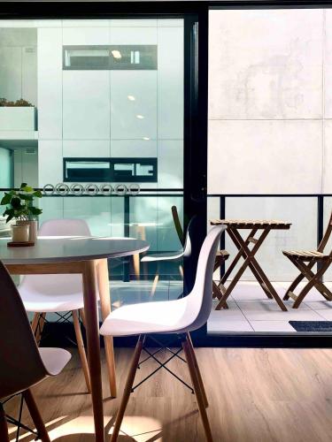 a dining room with a table and chairs at Town Center 1 Bedroom Cozy Home in Belconnen
