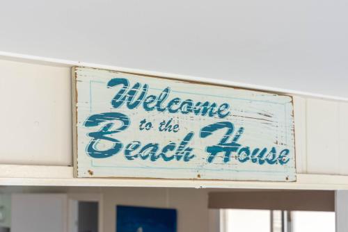 a sign that says indifference is the best house at The Golden Beach Residence in Golden Beach