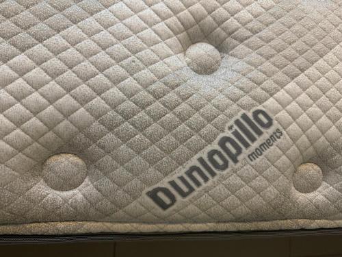 a close up of a mattress with a dunpython sign on it at 2 Bedroom 1 Bathroom Condo at Anvaya Cove in Morong
