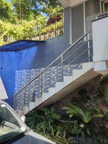 a set of stairs leading to a house at Easy guest apartment in Polgolla