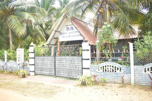 a building with a gate with a sign on it at DA GREA NATURAL BEACH HOTEL in Trincomalee