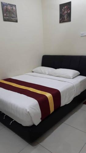 Ένα ή περισσότερα κρεβάτια σε δωμάτιο στο Camlodge budget hotel