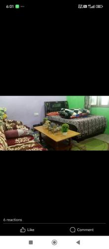 two pictures of a room with a bed and a table at Ganesh home stay in Ukhimath