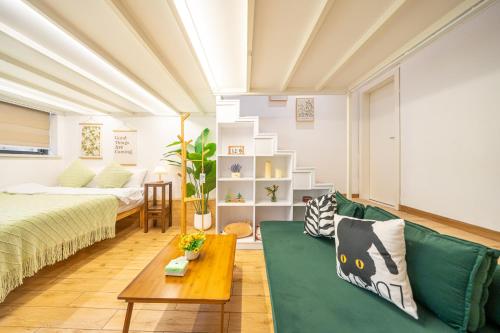 Postel nebo postele na pokoji v ubytování 柃居 B&B - IAPM Branch