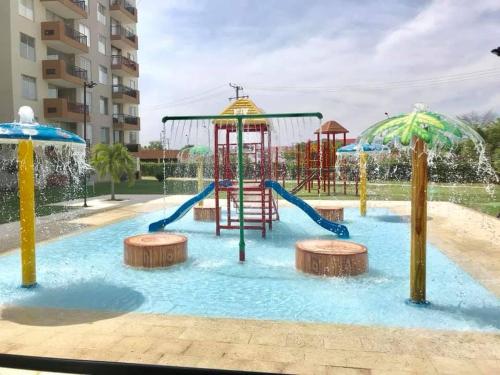 a water park with a playground with slides at Apartamento Hacienda Peñalisa in Ricaurte