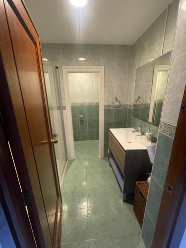 a bathroom with a tub and a sink and a shower at Alhamar Cabopino Living Apartment in Málaga