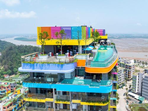 a building with a pool on top of it at Flamingo1 Ibiza Hai Tien in Nam Khê