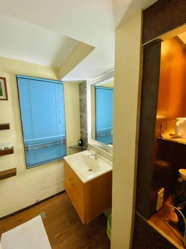 Katil atau katil-katil dalam bilik di Casa Verde Hotel & Events Center