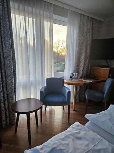 Ένα ή περισσότερα κρεβάτια σε δωμάτιο στο Rheinhotel Larus