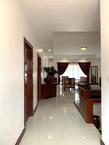 a living room with a couch and a table at Hawaii Beach Bungalows in Sihanoukville