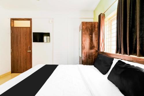 Ένα ή περισσότερα κρεβάτια σε δωμάτιο στο Hotel O by OYO High Bar Boarding And Lodging