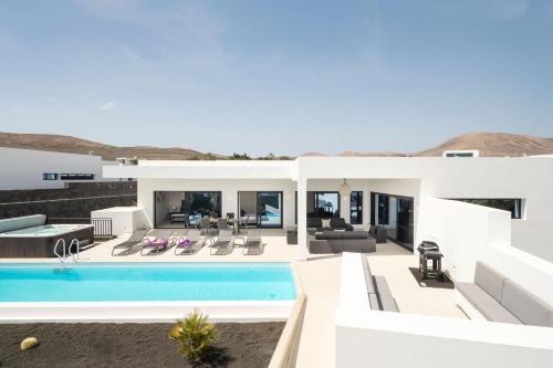 an image of a villa with a swimming pool at ODIN VILLAS by Buenavilla in Puerto Calero